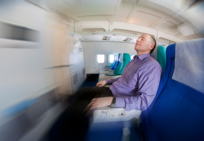Businessman Resting on a Plane